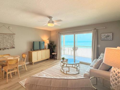a living room with a view of the ocean at Vacation Villas #432 - Beachfront Condo in Fort Myers Beach