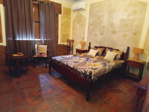 a bedroom with a bed in a room at Etno kuća Teodora in Staji°evo