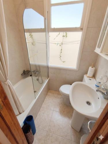 a bathroom with a sink and a toilet and a shower at Eco Mar - Cedeira in Cedeira