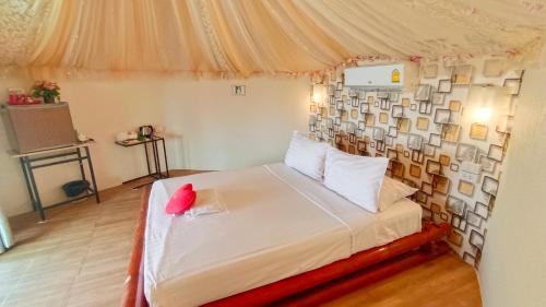 a bedroom with a bed in a tent at Pareehut Resort Koh Sichang in Ko Si Chang
