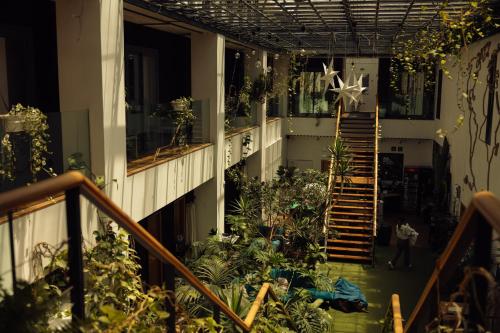 arium of a building with stairs and plants at Lisbon Destination in Lisbon