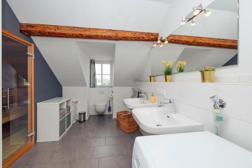 a bathroom with a sink and a toilet at Haus Spiegel - Cramergasse, Lindau Insel in Lindau