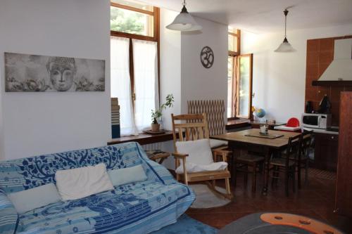 a living room with a couch and a table at Villa Gina in Villar Pellice