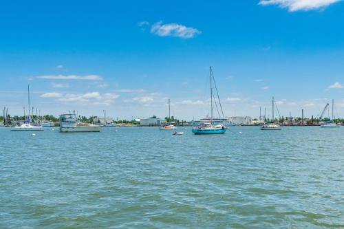 a group of boats in a large body of water at Lovers Key #508 by Sun Palace Vacations in Fort Myers Beach