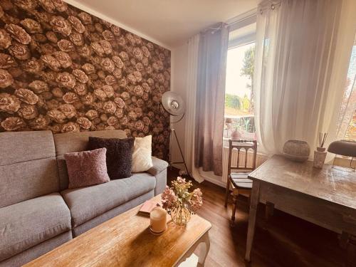 a living room with a couch and a table at Herzstück in Schwanebeck