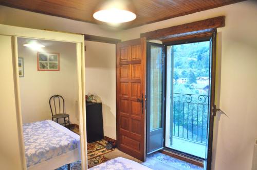 a room with a door leading to a balcony at Location Pierre in Tende