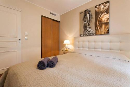 Postel nebo postele na pokoji v ubytování Carlton Riviera Apartment
