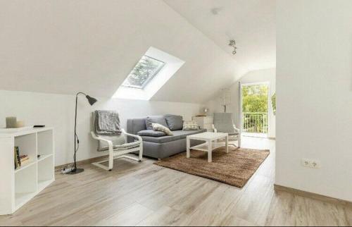 a living room with a couch and a table at Ferienwohnung Grüner Weg in Tecklenburg