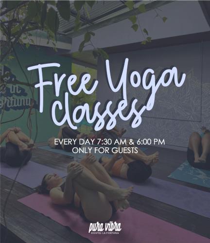 a group of people doing yoga in a yoga class at Pura Vibra Hostel in Fortuna
