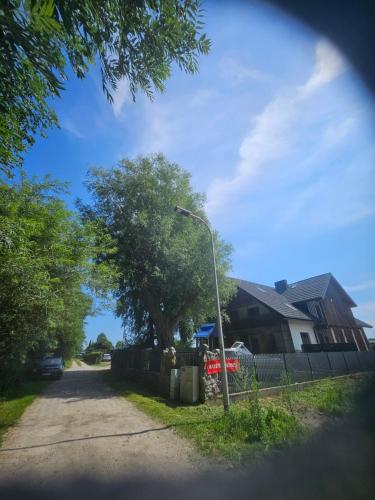a street light in front of a house at KAPITAŃSKA 88 - 3 min pieszo do plaży in Chłopy