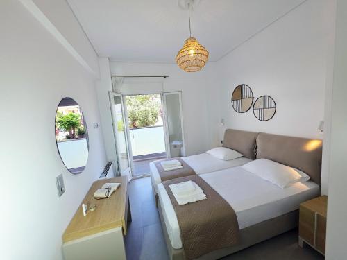 Llit o llits en una habitació de Naiada Apartments