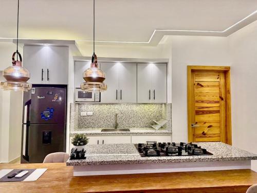 a kitchen with a stove top in a room at Apartamento Carmen céntrico in Santa Bárbara de Samaná
