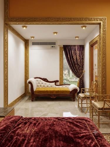 a bedroom with a couch and a large mirror at Tripo bay inn in Mahabalipuram