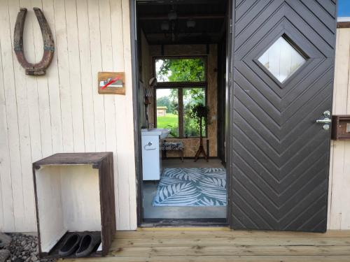 a door to a house with a zebra print rug at Sauna Suite 2 in Valga