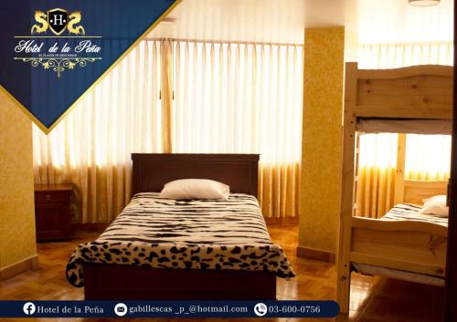 a bedroom with a bed and a bunk bed at Hotel de la Peña in Ambato