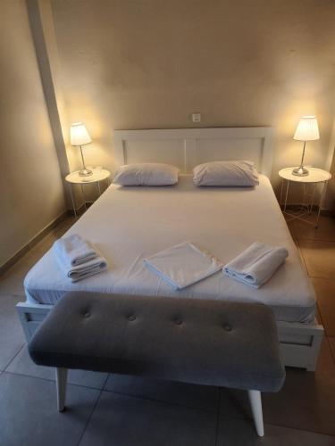 a bedroom with a large bed with two pillows at Spacious stay in Preveza