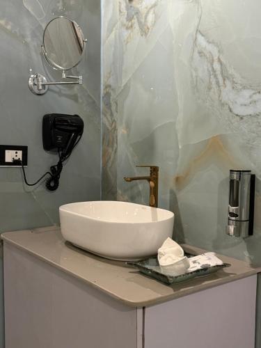 a white sink on a counter in a bathroom at Vanvaas the forest note in Godarpura
