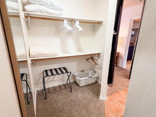 a room with a shelf and a stool and a chair at Lake and Mountains, 3BR 2BA in Show Low