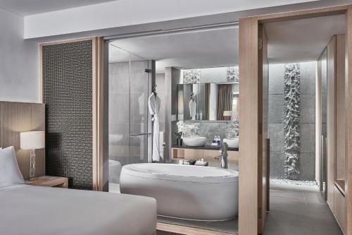 a rendering of a bathroom with a tub and a sink at Singapore Marriott Tang Plaza Hotel in Singapore