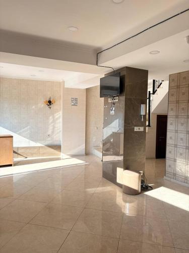 a room with a lobby with a glass wall at Suli Hostel in Tbilisi City