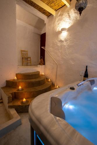 a room with stairs and a bed with lights at Elpiniki in Alinda
