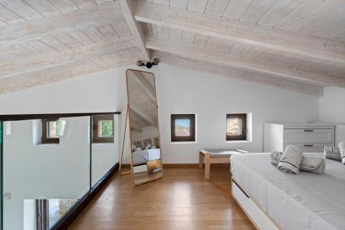 a bedroom with a large bed and a mirror at Πασιθεα in Spartokhórion