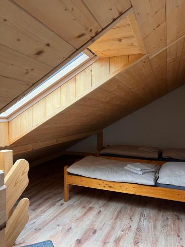 a bedroom with a bunk bed in a loft at Przy ścieżce in Węgierska Górka