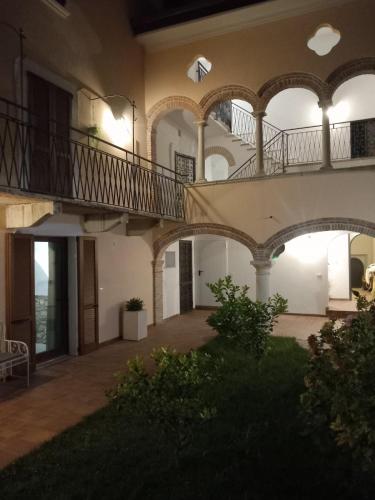 an empty courtyard of a house with a staircase at Il Casale in Soiano del Lago