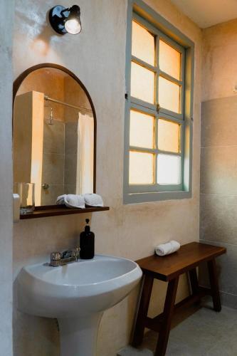 a bathroom with a sink and a mirror at Authentic Colonial & Central in Campeche