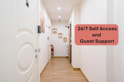 a laundry room with a sign that reads self access and guest support at Madame Bologna in Bologna