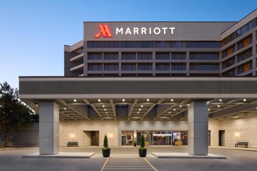a marriott hotel with a sign on top of it at Toronto Airport Marriott Hotel in Toronto