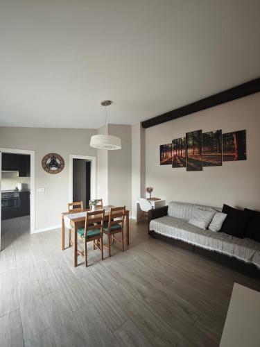 a living room with a table and a couch at Can Costals Cerezo in Pals