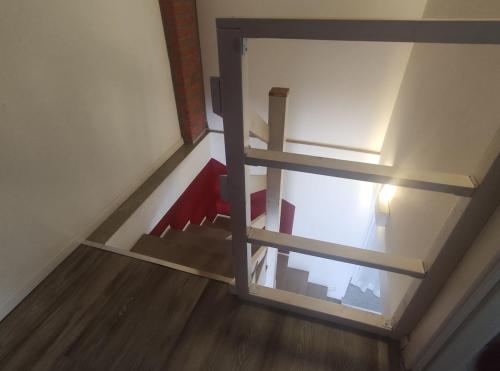 an overhead view of a room with wooden floors at Sweet Home in Corbetta