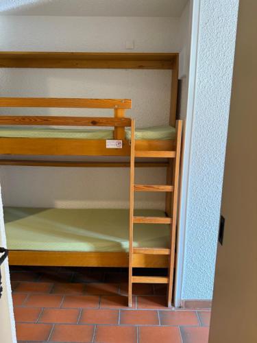 a small room with a bunk bed in it at Apparthotel Saint Tropez centre in Saint-Tropez
