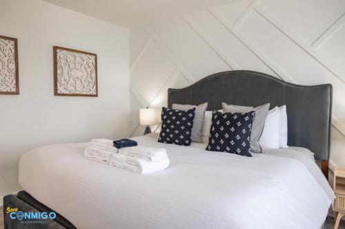 a bedroom with a bed with towels on it at Pooley Pad in American Fork