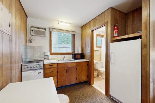 a kitchen with a sink and a stove top oven at King Birch Lake Home, Unit 5 in Alton