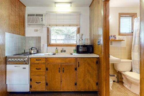 a kitchen with a sink and a stove at King Birch Lake Home, Unit 3 in Alton