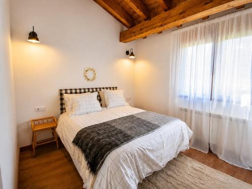 a bedroom with a bed and a large window at Jaricha in Cabezas Altas