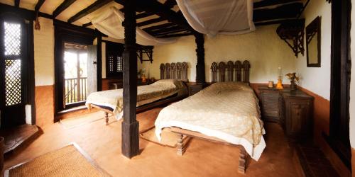 a bedroom with two beds in a room at The Famous Farm in Nawākot