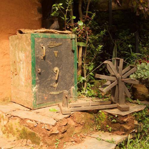 an old metal box with a wheel next to it at The Famous Farm in Nawākot