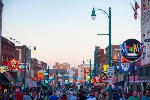 a busy city street with a crowd of people at Hyatt Centric Beale Street Memphis in Memphis