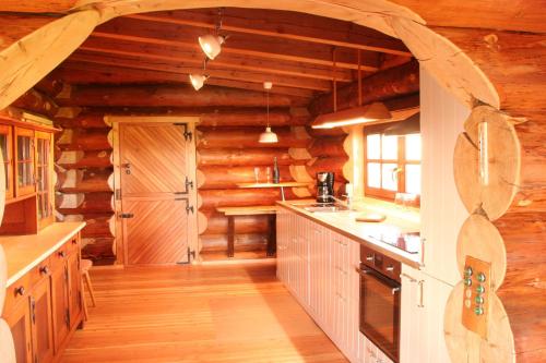 Kuchyň nebo kuchyňský kout v ubytování Dein Blockhaus