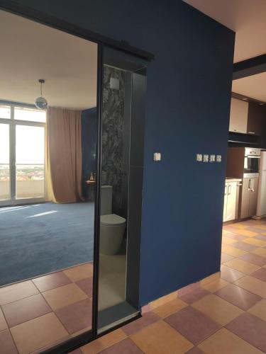 a bathroom with a toilet and a glass door at The VIEW in Belgrade