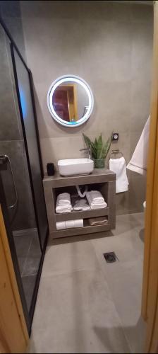 a bathroom with a sink and a mirror at Villa Mareta in Svoronata