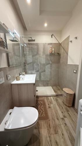 a bathroom with a toilet and a sink and a shower at argentario home in Porto Santo Stefano