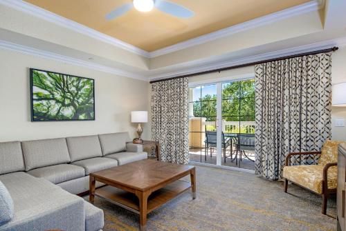 a living room with a couch and a table at WorldMark Reunion in Kissimmee