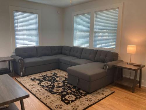 a living room with a couch and a table at East Nashville Discovery in Nashville
