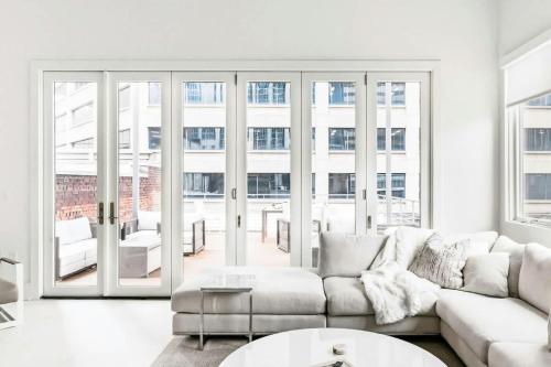 a living room with a couch and a table at Rooftop Condo in Nashville