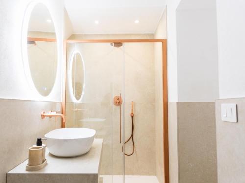 a bathroom with a sink and a shower at Casa Nacci Accoglienza di Lusso in Brindisi