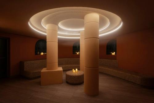 a room with a circular ceiling with candles in it at Nômade Temple Madrid in Madrid